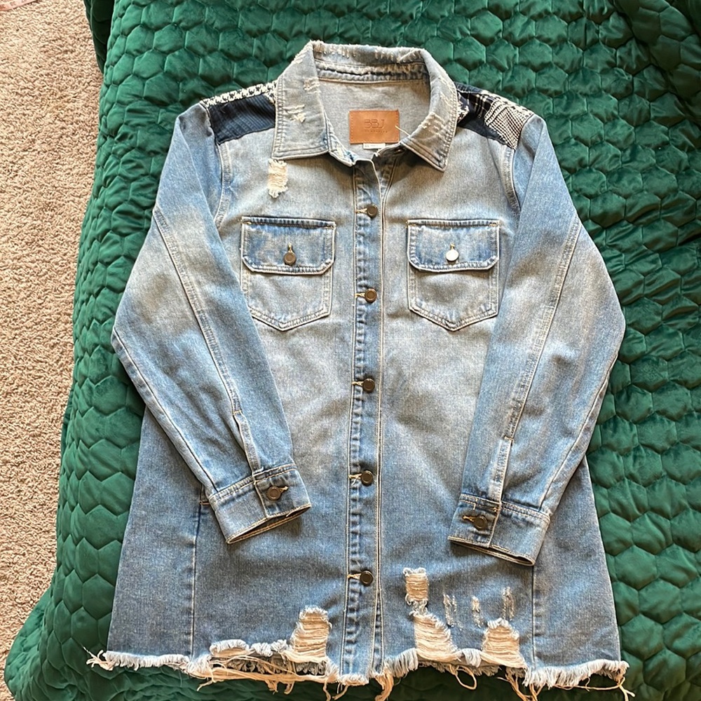 Oversized denim jacket with patchwork detail on back. Lightly worn